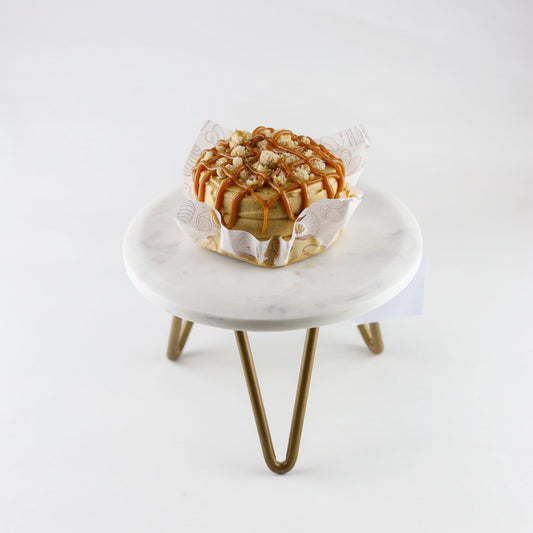 Dulce de leche cake with sableé crumble, dulce de leche custard, and frosting — ready for pickup at Shelíss Bakeshop