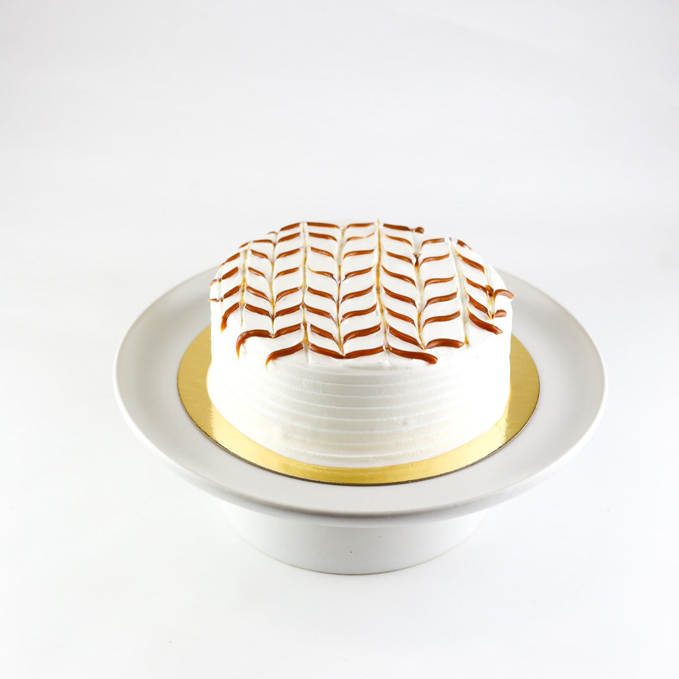 Tres leches cake with dulce de leche filling, chantilly cream topping, and caramel drizzle – available for pickup.