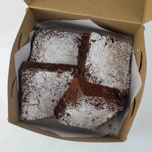 Box with 4 belgian chocolate brownie with pecans fresh and ready to pick up at Shelíss Bakeshop