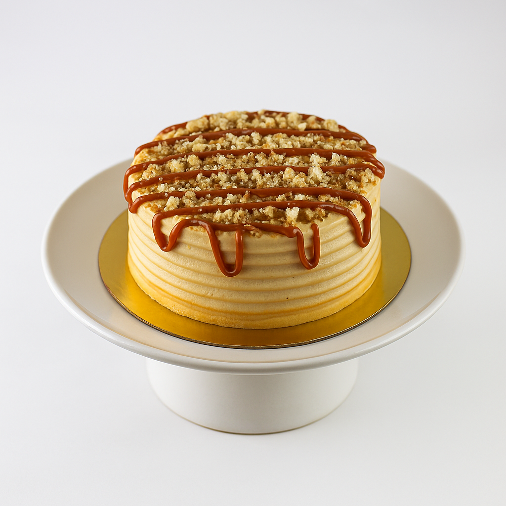 Dulce de leche cake with sableé crumble, caramel custard, and frosting — ready for pickup at Shelíss Bakeshop