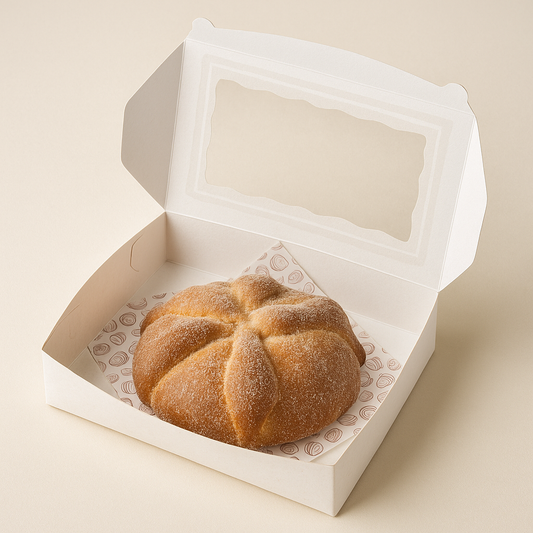 Large traditional Mexican Pan de Muerto bread with sugar topping, soft golden crust, perfect for Día de Muertos celebrations