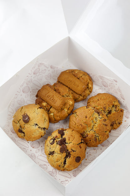 Chunky NYC-style cookies in assorted flavors: Oreo, Nutella, Biscoff, and walnut chocolate chip — fresh from Shelíss Bakeshop.